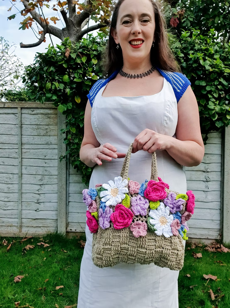 Woman holding flower crochet bag