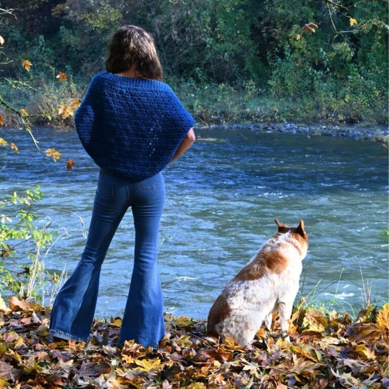 Woman dog river autumn leaves