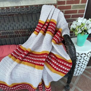 Striped crocheted throw blanket