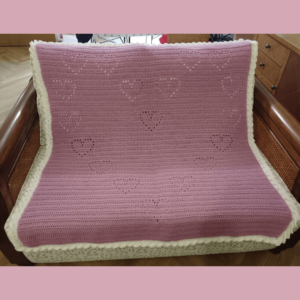 Pink crochet heart blanket
