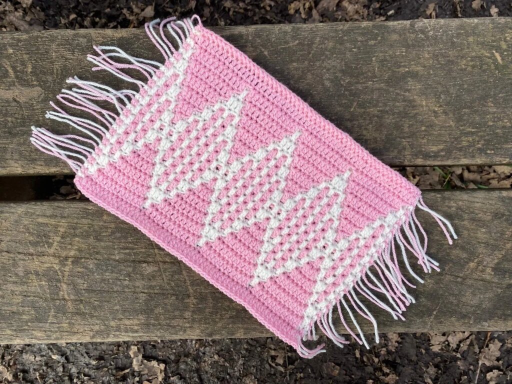 Pink crocheted diamond pattern mat