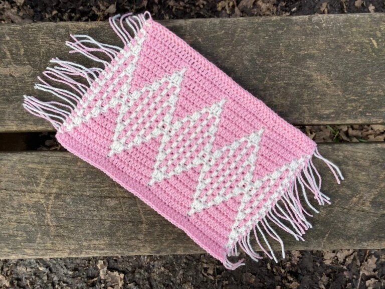 Pink crocheted diamond pattern mat