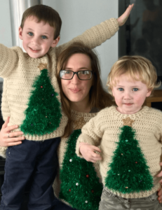 Family in matching Christmas sweaters