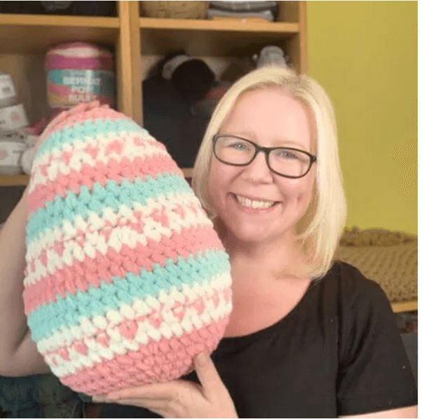Happy crafter with crochet egg