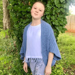 Young girl blue cardigan