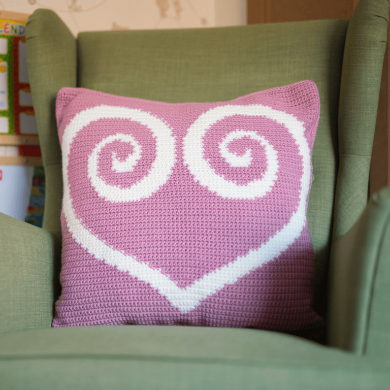 Pink crochet heart pillow