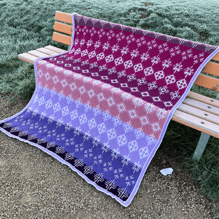 Geometric crochet blanket on bench