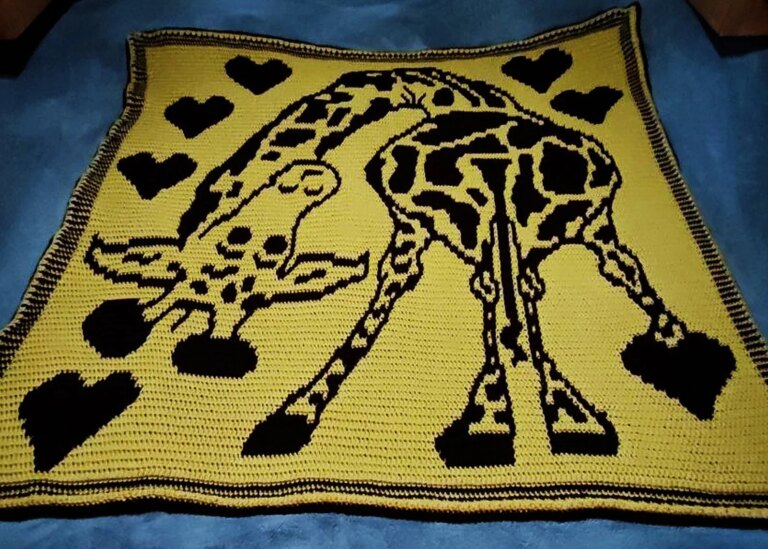 Crocheted giraffe heart blanket