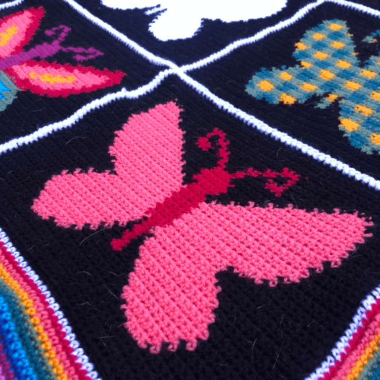 Pink knitted butterfly blanket