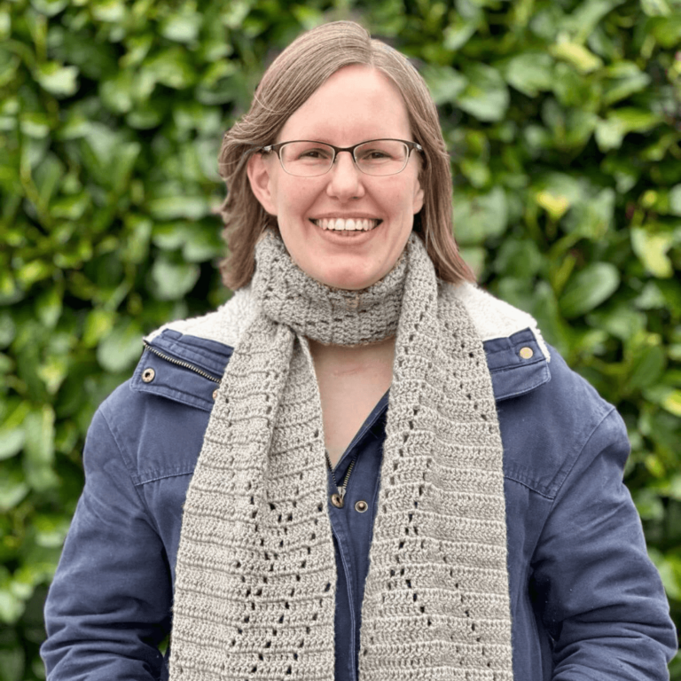 Woman smiling crochet scarf
