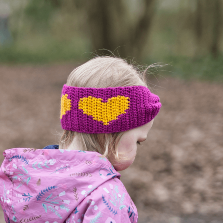 Child wearing crochet heart headband